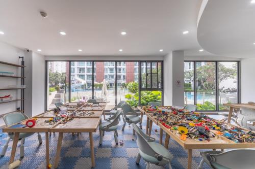 a room with long tables and chairs with legos on them at The One Chiang Mai 214 - Family Suite 2BR 2bath, Pool View near Central Festival in Chiang Mai