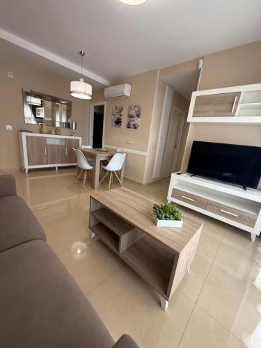 a living room with a couch and a coffee table at Casa Miriam Family Lux in Oropesa del Mar