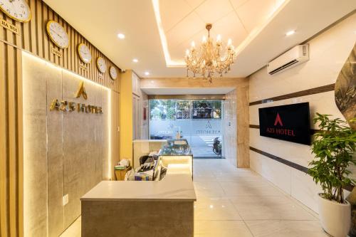 a lobby of a us hotel with clocks on the wall at A25 Hotel - 75 Lê Thị Hồng Gấm in Ho Chi Minh City