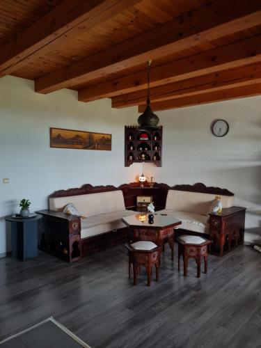 a living room with a couch and a table at Vienna Rem in Lukavac