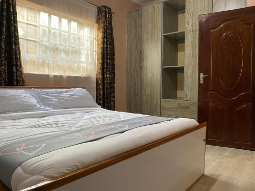 Ένα ή περισσότερα κρεβάτια σε δωμάτιο στο Brixton BnB