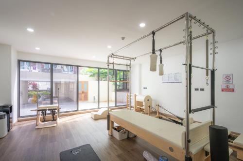 a room with a bed and a large window at The One Chiang Mai 420 - Deluxe 1BDR Pool View near Central Festival in Chiang Mai