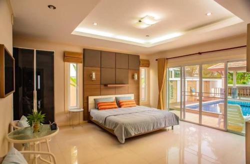 Ένα ή περισσότερα κρεβάτια σε δωμάτιο στο ZJ Garden Pool Villa