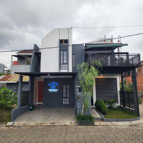 a building with a sign on the front of it at Villa Yo and By in Karangploso