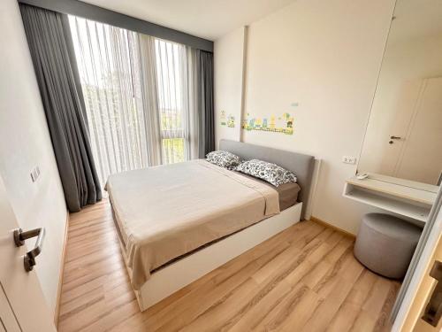 Postel nebo postele na pokoji v ubytování The Base Uptown