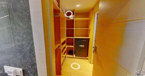 a room with a hallway with shelves and a door at Villa 9- luxurious 5 bedrooms villa in the heart of Ambassadors in Rabat