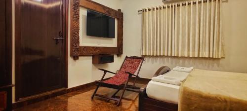 Ένα ή περισσότερα κρεβάτια σε δωμάτιο στο Hotel Manorama