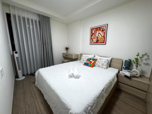 Una cama o camas en una habitación de The Glory Midori Park 2BR Pool Gym free, gần Aeon