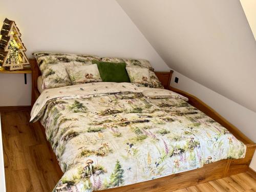 a bedroom with a bed in a attic at Apartment K&L Boží Dar in Boží Dar