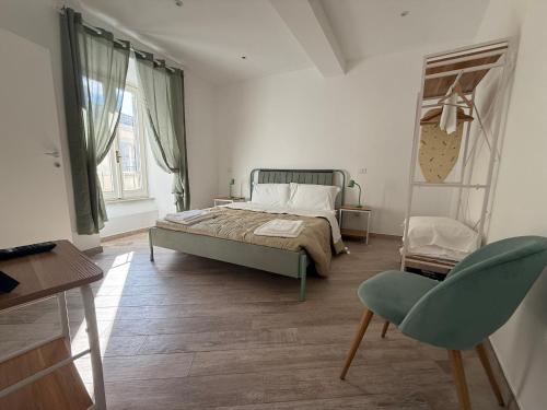 Postel nebo postele na pokoji v ubytování Albano Film Home - Castelli Apartments