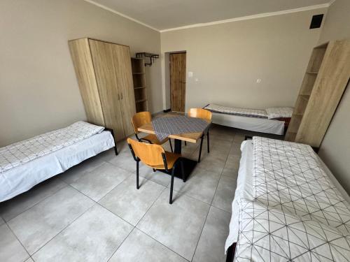 Ένα ή περισσότερα κρεβάτια σε δωμάτιο στο Relaks Noclegi