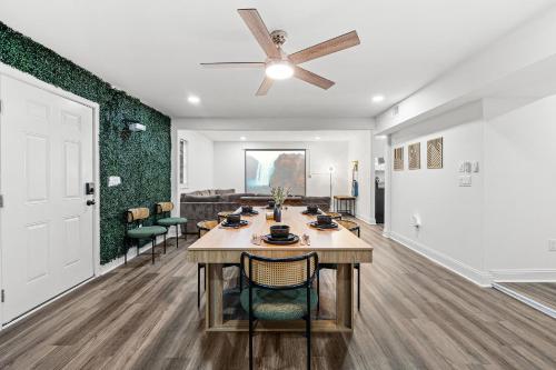 a dining room with a table and a ceiling fan at 2 King Beds Cozy Athens GA Getaway in Athens