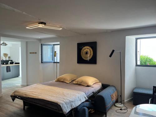 En eller flere senge i et værelse på Studio dans maison typique du cap Corse