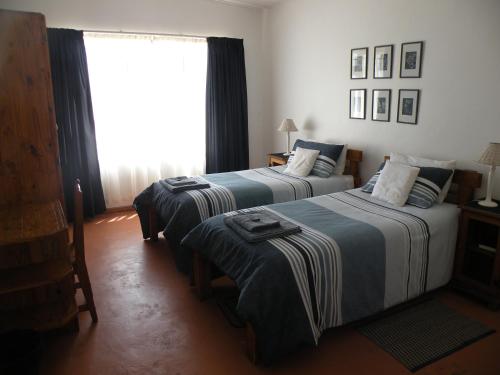 Ένα ή περισσότερα κρεβάτια σε δωμάτιο στο Honne-Hemel Oubaas