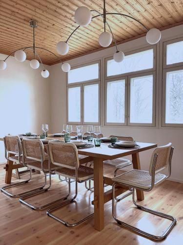 a large dining room with a table and chairs at Lapland Dream Destinations in Rovaniemi