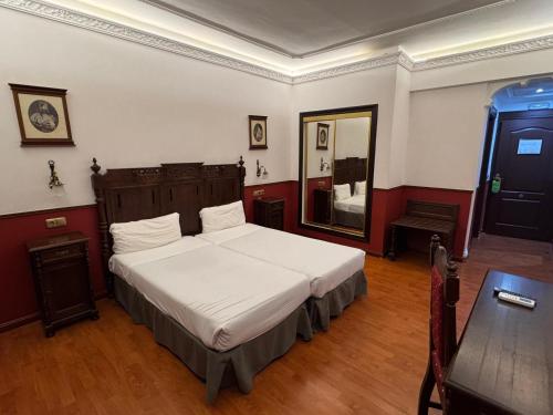 Giường trong phòng chung tại Hotel El Cisne