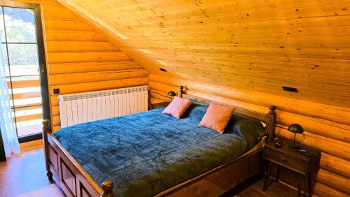 Postel nebo postele na pokoji v ubytování Cabana Valea Bistrei