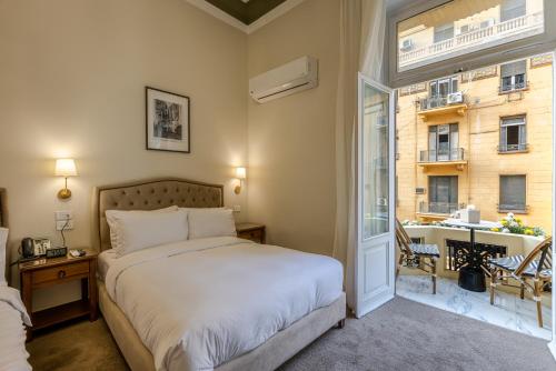 Postel nebo postele na pokoji v ubytování Cairo Inn The Royal