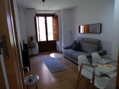 a living room with a couch and a glass table at Rental in the center of Granada 1B in Granada