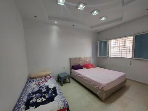 Postel nebo postele na pokoji v ubytování Rez-de-chaussée garage wifi 5Ggratuit gaz de ville