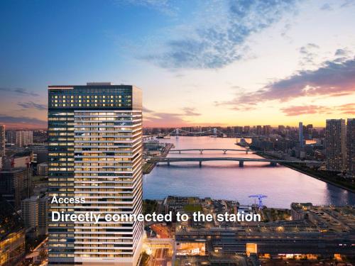 a view of a city with a river and a bridge at Mitsui Garden Hotel Toyosu Premier - Tokyo in Tokyo