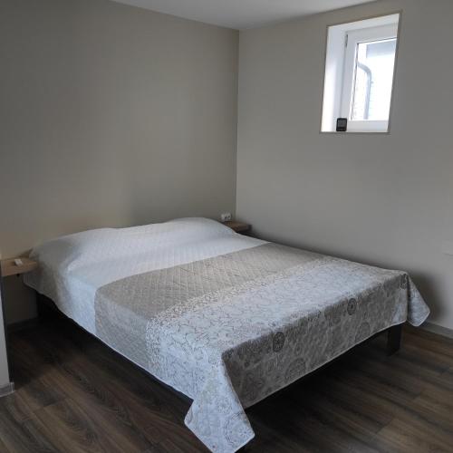 Ένα ή περισσότερα κρεβάτια σε δωμάτιο στο Tammiste Holiday House