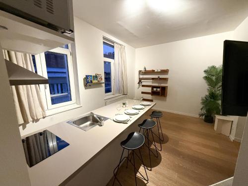 TV a/nebo společenská místnost v ubytování Studio 204 cosy au centre de Bruxelles