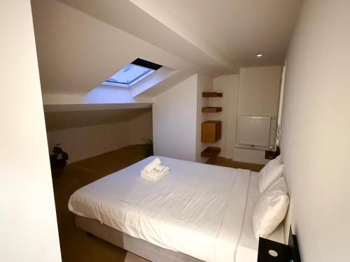 Postel nebo postele na pokoji v ubytování Studio 204 cosy au centre de Bruxelles