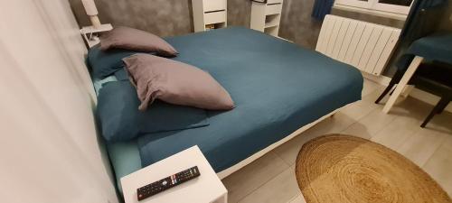 Ένα ή περισσότερα κρεβάτια σε δωμάτιο στο Le Doux Normand