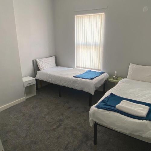 Postel nebo postele na pokoji v ubytování Pitchside House - sleeps 4