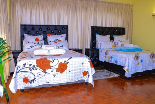 two beds in a room with two beds sidx sidx sidx at E Point guest house in Johannesburg
