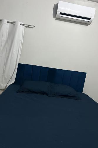 En eller flere senge i et værelse på Casa para 4 pessoas próximo ao Hangar