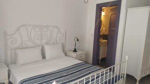 Cama o camas de una habitación en Noonbir Alaçatı otel