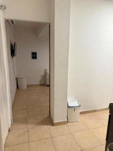 a hallway with two toilets and a trash can at Alquiler Apartamento Resistencia Chaco in Resistencia