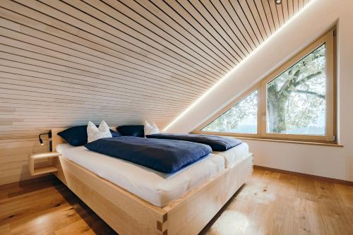 Postel nebo postele na pokoji v ubytování Lindenhof Chalets