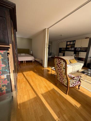 a living room with a bed and a couch at Vue Mer Santa Clara 3 in La Baule