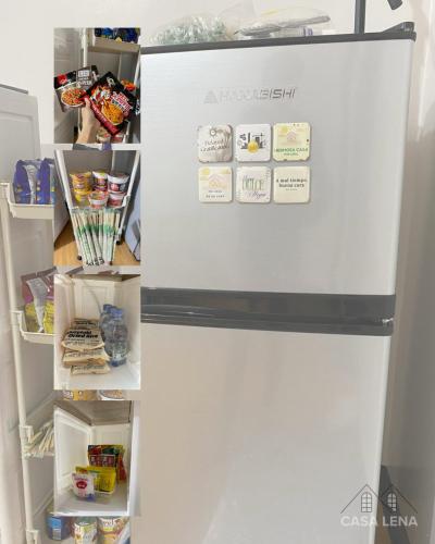 a refrigerator with magnets on it in a kitchen at Casa Lena - Bulacan Staycation in Marilao