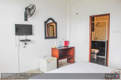 TV a/nebo společenská místnost v ubytování New Ella Nature View