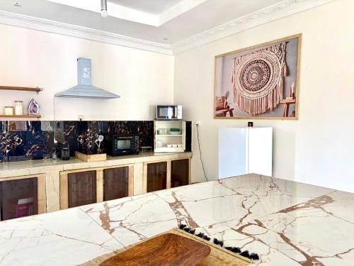 Η κουζίνα ή μικρή κουζίνα στο Home TERANGA hébergement au premier étage