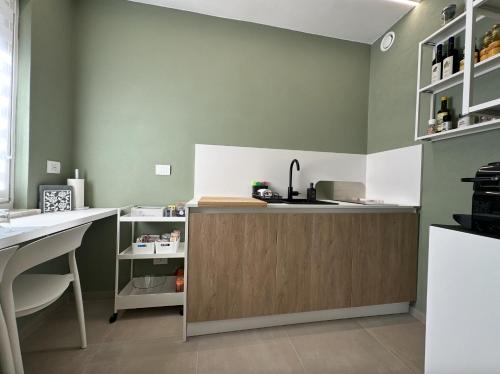 a kitchen with a counter with a sink and a counter sidx sidx sidx at IsabellaGuestHouse in Chiusa di Pesio