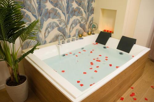 a bathroom with a bath tub with flowers on it at Attimo d'amore in Quinto Vicentino