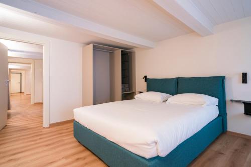 Ένα ή περισσότερα κρεβάτια σε δωμάτιο στο Aosta Holiday Apartments - Croix-de-Ville