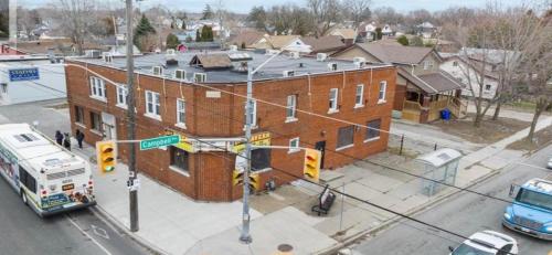 an overhead view of a street with a large brick building at Baby Hotel By BYD in Windsor