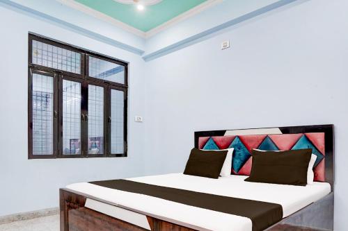 Voodi või voodid majutusasutuse Hotel O Om Sai Garden toas