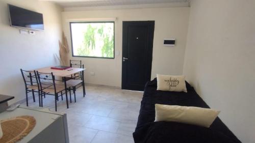 a living room with a couch and a table at Airecillos de la Banda in Tilcara