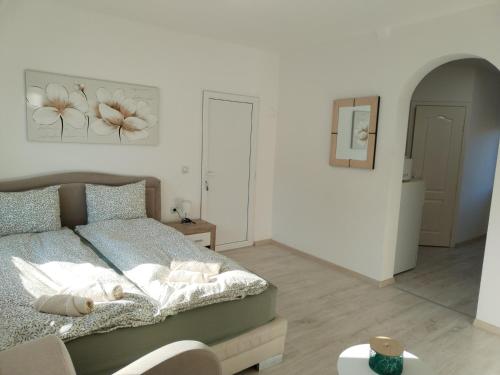 a bedroom with a bed and a picture on the wall at Andrijana in Soko Banja