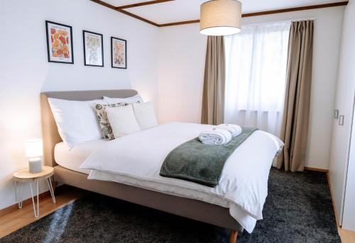 Ένα ή περισσότερα κρεβάτια σε δωμάτιο στο Haus Wiesengrund mit 2 separaten Wohnungen