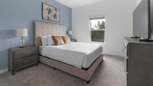 Ένα ή περισσότερα κρεβάτια σε δωμάτιο στο Landing Amazing 1BD Gym Clubhouse