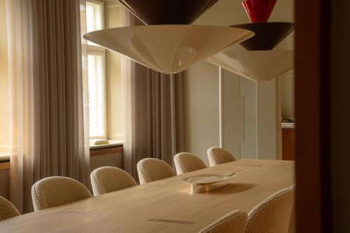 a dining room with a table and chairs at Four Suites Copenhagen in Copenhagen