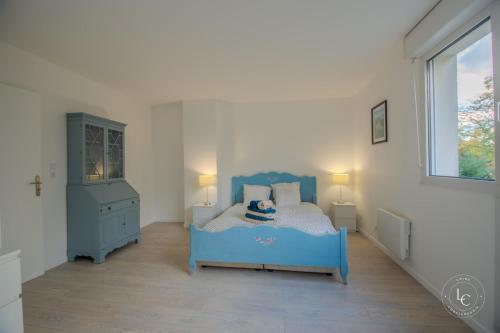 Postel nebo postele na pokoji v ubytování La Brayoise Near Orléans cozy house with garden & pétanque